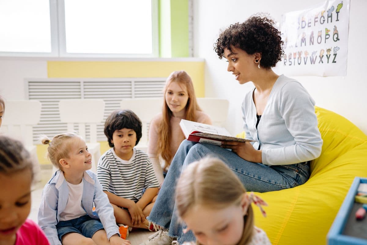 Child learning at a desk with school support during ABA therapy collaboration
